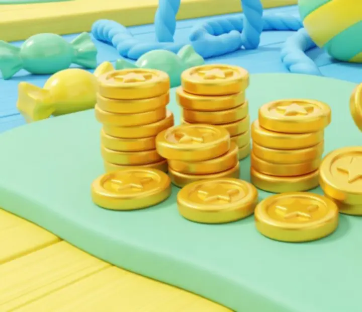 Stylized coins from Cut the Rope 2 stacked near candy and stars