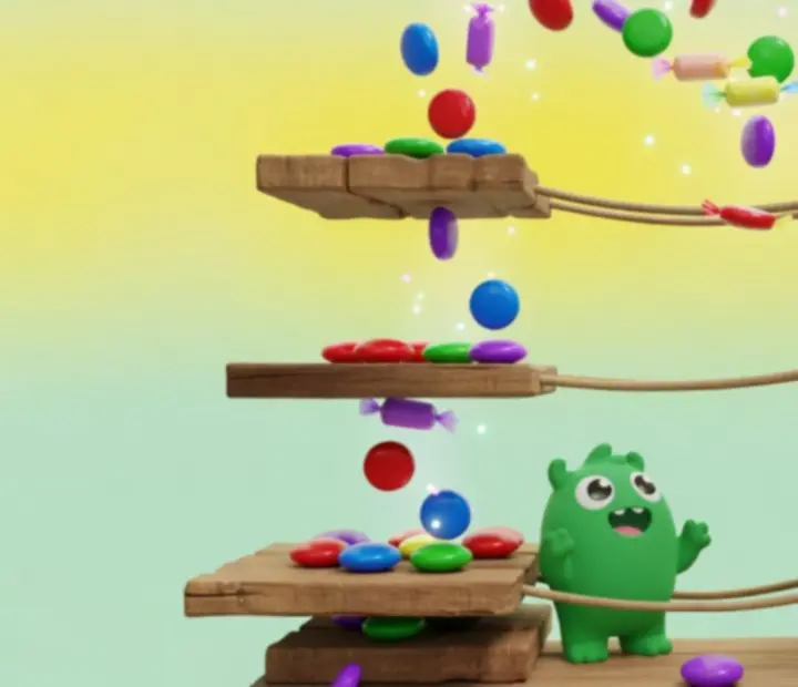 Scene of colourful candy pieces raining through a Cut the Rope 2 forest puzzle, landing near the waiting monster